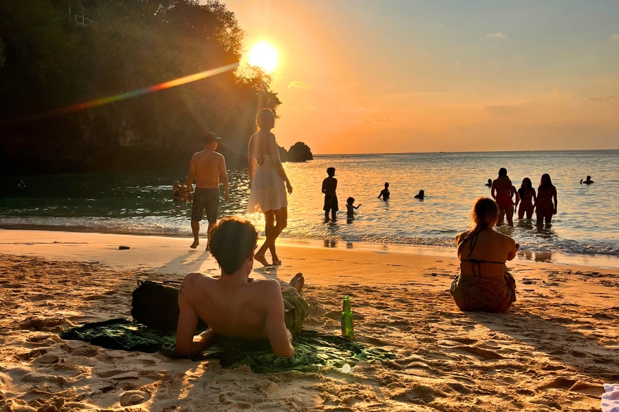 Padang Padang Beach Otherwise Know As Eat, Pray, Love Beach At Sunset With The Sun Slipping Behind The Rocks